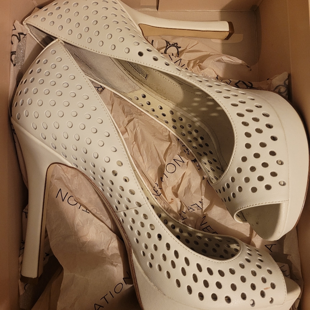 Barely worn white peep toe pumps